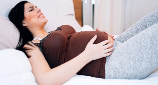 thai nhi tuần 18 - những cơn đau tức ở vùng bụng dưới hoặc những cơn đau nhói ngắn sẽ thỉnh thoảng xuất hiện